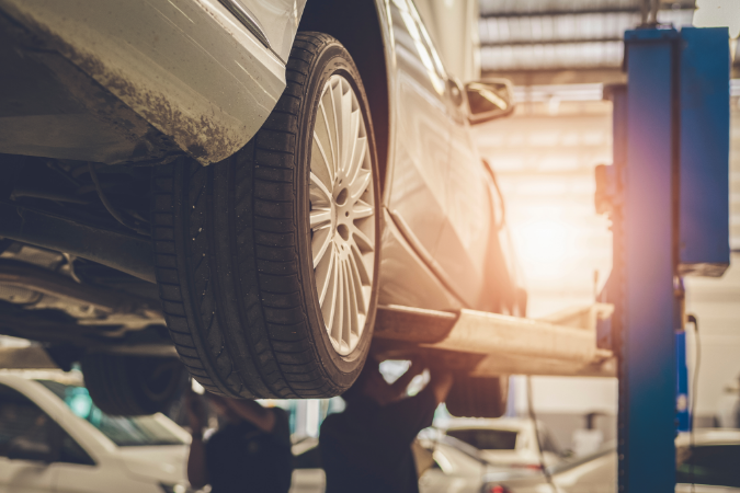 Vehicle on a professional lift for inspection and repair at RepairTech Automotive